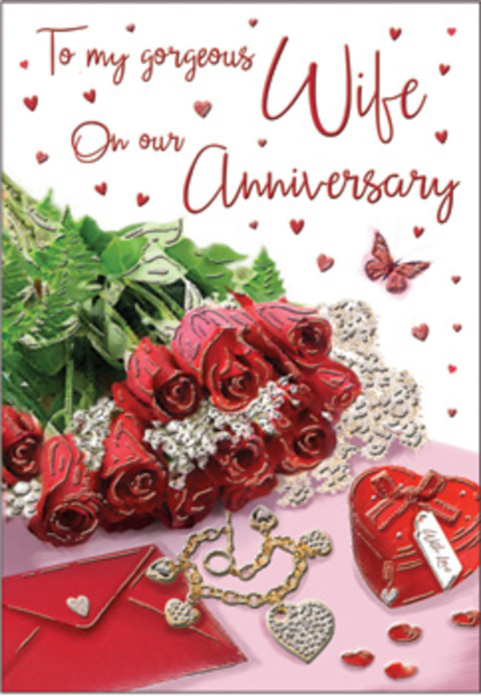 A richly detailed anniversary card design is laid out as though on a console table in a Stevenage living room, every element placed with deliberate care. At the heart of the image, a small bouquet of classic red roses commands attention, their blooms fully formed and velvety, with deep, wine-red petals folding over one another in plush spirals. The roses are surrounded by fresh green foliage, the leaves gently arching and offering a cool contrast, much like the soothing green spaces that break up the townscape near Fairlands Valley Park. Adjacent to this floral focus rests a greeting card and its envelope, overlapping slightly, the card's surface adorned with hints of scripted wording that suggests a deeply personal message. Lying close to the card is a piece of elegant jewellery, its delicate metal curves and subtle sparkle hinting at a thoughtful anniversary gift chosen with care. A heart-shaped keepsake box completes the cluster, its rounded form and smooth finish evoking the idea of treasured mementos and memories kept safely through the years. Scattered around are tiny red hearts and glimmering decorative accents that catch the available light, adding a sense of movement and joyful celebration, like reflections on a shop window along Queensway. A single butterfly motif hovers in the composition, almost weightless, symbolising renewal and the continuing evolution of a shared life together. The lighting is gentle and even, caressing the roses, foliage, card, jewellery, and hearts, and bringing out their textures-soft petals, glossy leaves, polished metal, and smooth card stock. The scene feels like something an experienced florist at Flowers Stevenage might compose, capturing the essence of an anniversary marked not just with gifts, but with genuine emotion and a shared history woven through everyday life in the town.